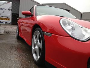 Shiny red sports car after a car valet from mmvaleting.